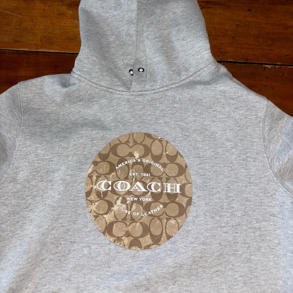 Coach hoodie, grey hoodie with coach logo and tag.